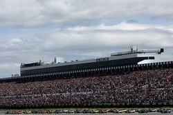 The field heads for the start line to take the green flag