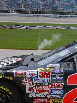 Water pours from the overflow on Carl Long's car