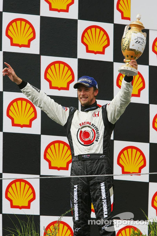Podium: race winner Jenson Button celebrates