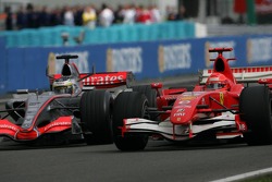 Pedro de la Rosa and Michael Schumacher go side by side