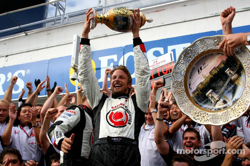 Race winner Jenson Button celebrates with Honda Racing F1 team members