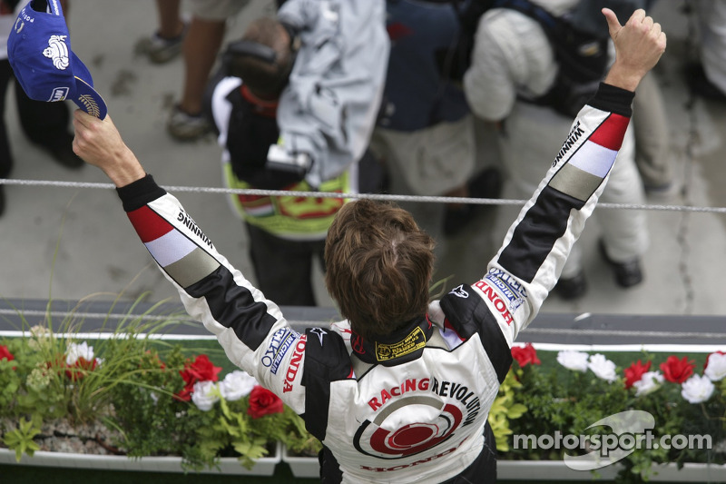 Podium: race winner Jenson Button celebrates