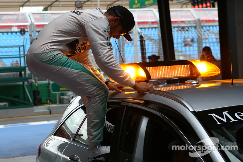 Pole winner Lewis Hamilton, Mercedes AMG F1 jumping out of the medical car