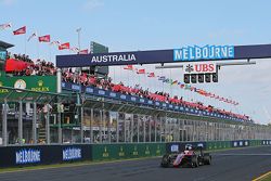 Jenson Button, McLaren MP4-30 takes the chequered flag at the end of the race