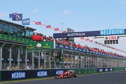 Third placed Sebastian Vettel, Ferrari SF15-T takes the chequered flag at the end of the race