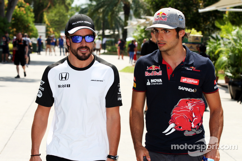 Fernando Alonso, McLaren with Carlos Sainz Jr. Scuderia Toro Rosso