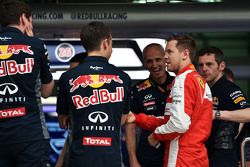 Sebastian Vettel, Ferrari visits the Red Bull Racing pit garage