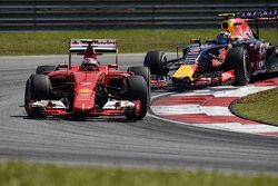 Kimi Raikkonen, Ferrari SF15-T leads Daniil Kvyat, Red Bull Racing RB11