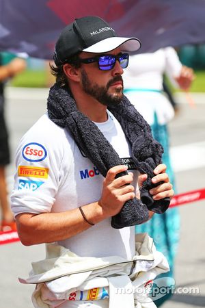Fernando Alonso, McLaren as the grid observes the national anthem