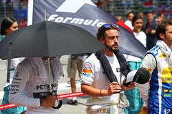 Lewis Hamilton, Mercedes AMG F1 and Fernando Alonso, McLaren as the grid observes the national anthem