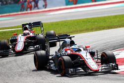 Fernando Alonso, McLaren MP4-30 leads team mate Jenson Button, McLaren MP4-30