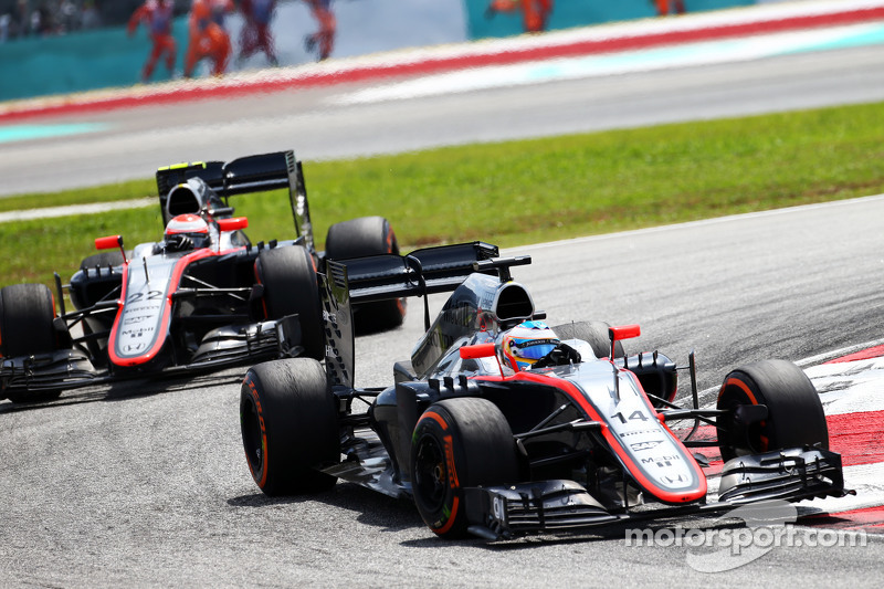 Fernando Alonso, McLaren MP4-30 leads team mate Jenson Button, McLaren MP4-30