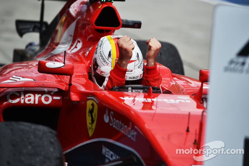 Race winner Sebastian Vettel, Ferrari SF15-T celebrates in parc ferme