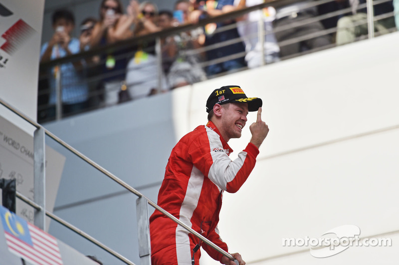 Race winner Sebastian Vettel, Ferrari celebrates on the podium