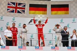 The podium, Mercedes AMG F1, second; Sebastian Vettel, Ferrari, race winner; Nico Rosberg, Mercedes AMG F1, third