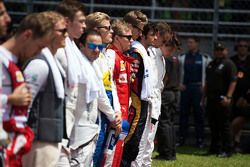 Kimi Raikkonen, Ferrari with the drivers as the grid observes the national anthem