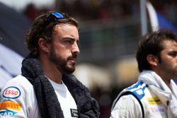 Fernando Alonso, McLaren with the drivers as the grid observes the national anthem