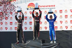 Podium: Second place Will Power, Team Penske Chevrolet, Race winner Juan Pablo Montoya, Team Penske Chevrolet and Third place Tony Kanaan, Chip Ganassi Racing Chevrolet