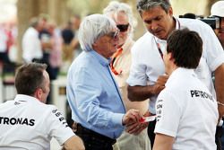 (L to R): Paddy Lowe, Mercedes AMG F1 Executive Director, with Bernie Ecclestone, of the FOM; and Toto Wolff, Mercedes AMG F1 Shareholder and Executive Director