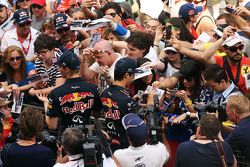 (L to R): Daniil Kvyat, Red Bull Racing and Daniel Ricciardo, Red Bull Racing sign autographs for the fans
