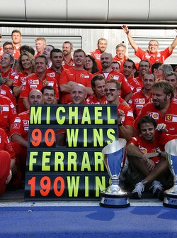 Michael Schumacher celebrates his 90th win and the 190th for Ferrari with Ferrari team members