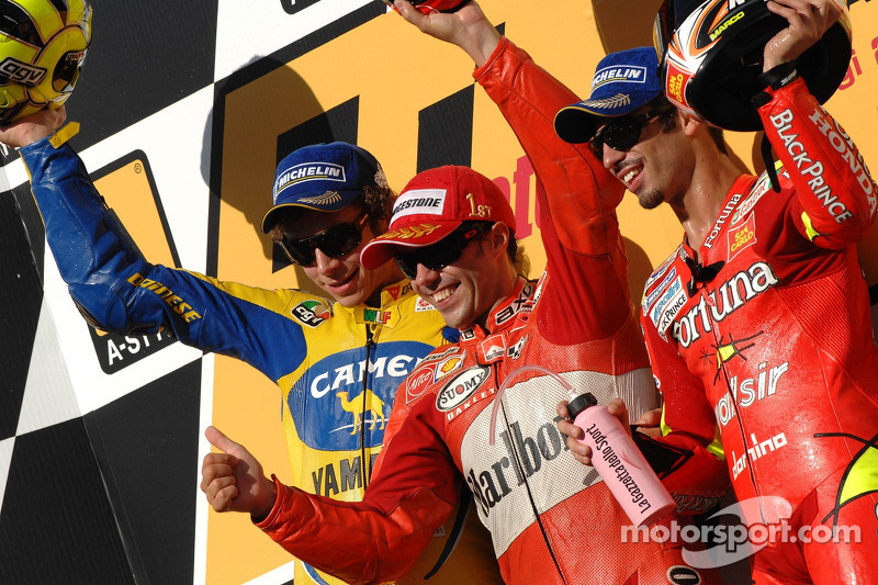 Podium: 1. Loris Capirossi, 2. Valentino Rossi, 3. Marco Melandri