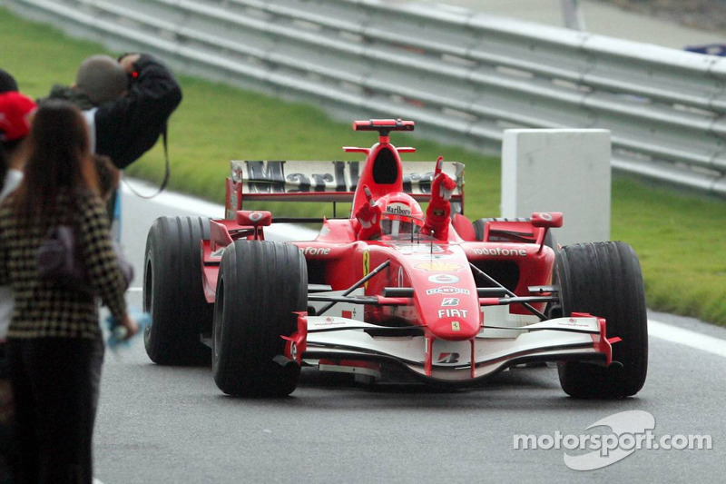 Race winner Michael Schumacher celebrates