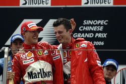 Podium: race winner Michael Schumacher celebrates with Chris Dyer