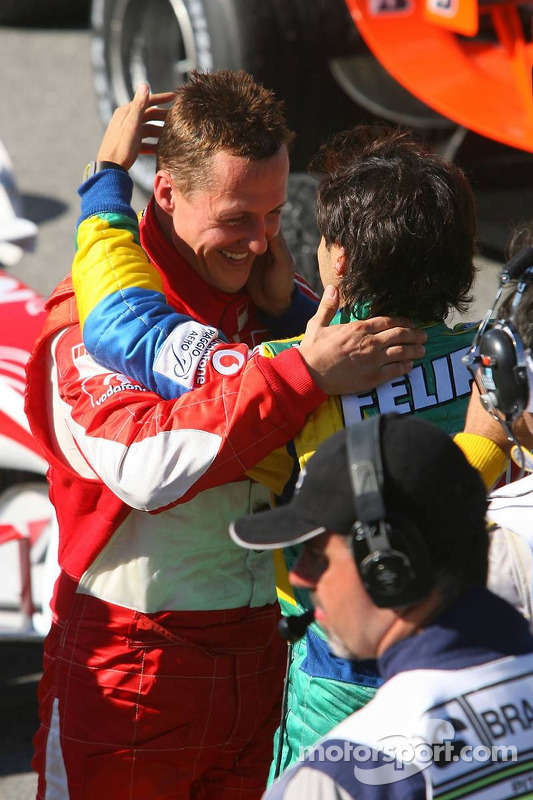 Race winner Felipe Massa congratulated by Michael Schumacher
