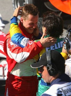 Race winner Felipe Massa congratulated by Michael Schumacher