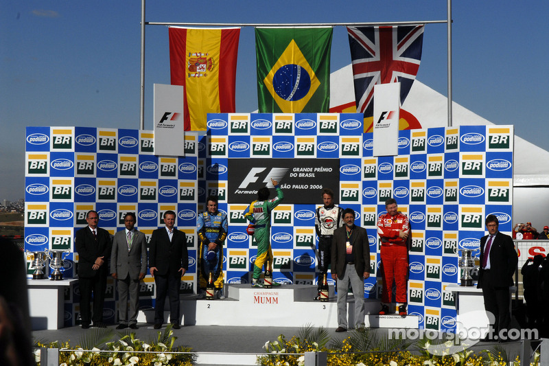 Podium: race winner Felipe Massa with 2006 World Champion Fernando Alonso and Jenson Button