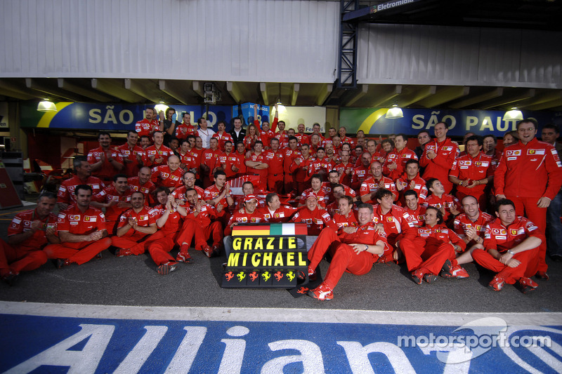 Michael Schumacher celebrates his retirement with Ferrari team members