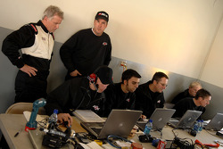 Ricky Rudd and Butch Hylton look over the data gathered from the Robert Yates Racing engineering staff