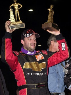 Tony Stewart added a second Golden Driller to his trophy collection by winning Saturday night's 50-lap O'Reilly Chili Bowl Midget Nationals championship finale
