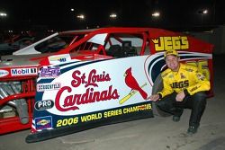 Kenny Wallace races a dirt modifed at nearby Volusia Speedway Park; an ardent St. Louis Cardinals fan, he carries the Cardinals' colors on his car