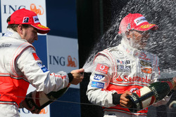 Podium: champagne for Fernando Alonso and Lewis Hamilton