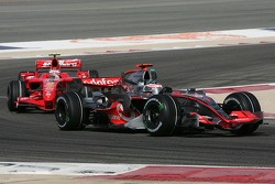Fernando Alonso, McLaren Mercedes, MP4-22 and Kimi Raikkonen, Scuderia Ferrari, F2007