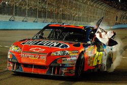 Race winner Jeff Gordon honors the late Dale Earnhardt