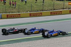 Felipe Nasr, Sauber C34 leads Marcus Ericsson, Sauber C34 and Jenson Button, McLaren MP4-30 at the start of the race