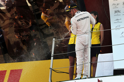 Lewis Hamilton, Mercedes AMG F1 celebrates his second position with the champagne on the podium