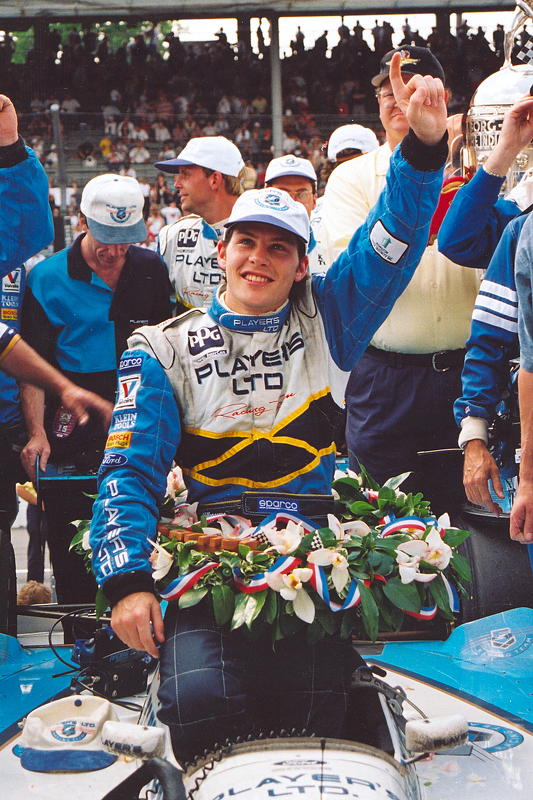 Race winner Jacques Villeneuve celebrates