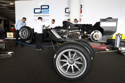 Martin Brundle has a seat fitting for a demonstration run of a GP2 car with 18 inch Pirelli tyres