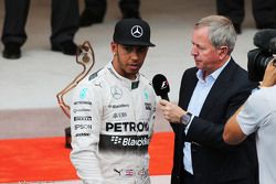 Lewis Hamilton, Mercedes AMG F1 on the podium with Martin Brundle, Sky Sports Commentator