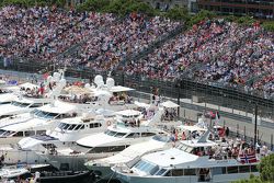 Boats in the scenic Monaco Harbour passed by Daniil Kvyat, Red Bull Racing RB11