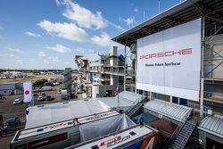 Porsche advertising banner overlooking the paddock