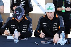 Sergio Perez, Sahara Force India F1 and team mate Nico Hulkenberg, Sahara Force India F1 sign autographs for the fans
