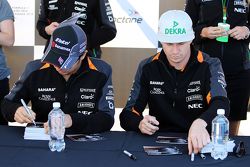 Sergio Perez, Sahara Force India F1 and team mate Nico Hulkenberg, Sahara Force India F1 sign autogr