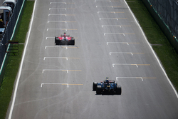 Kimi Raikkonen, Ferrari SF15-T leads Pastor Maldonado, Lotus F1 E23