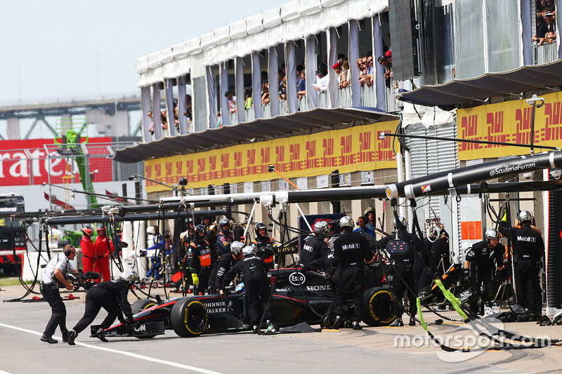 Fernando Alonso, McLaren MP4-30 pulls into the pits to retire from the race