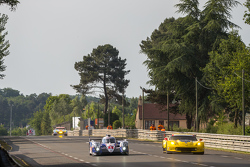 #1 Toyota Racing Toyota TS040 Hybrid: Sébastien Buemi, Anthony Davidson, Kazuki Nakajima passing the #63 Corvette Racing Corvette C7.R: Jan Magnussen, Antonio Garcia, Ryan Briscoe